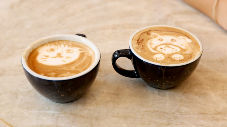 Two lattes with latte art