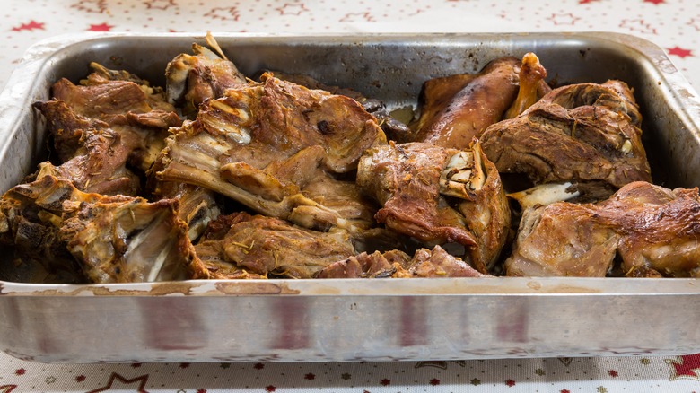 Cabrito meat in a metal pan