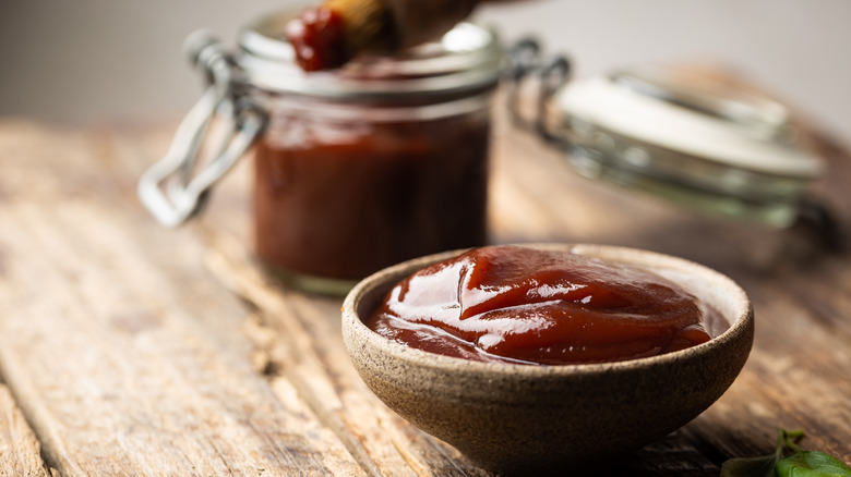 Barbecue sauce in bowl and jar