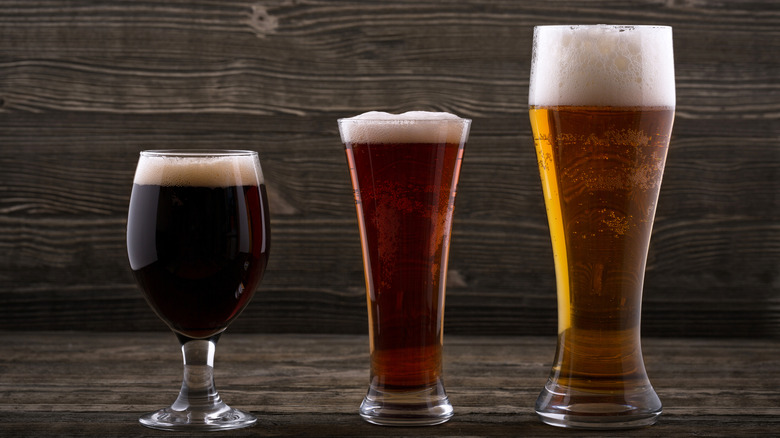 different types of beer on a dark background