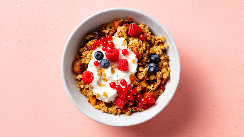 Granola topped with muesli and fresh berries