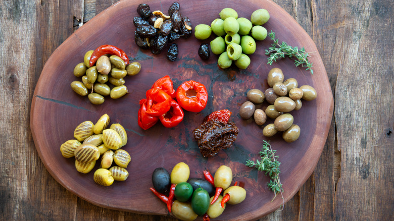 assorted olives on cutting board