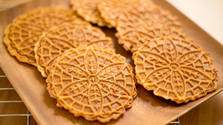 Several pizzelle cookies on a tray