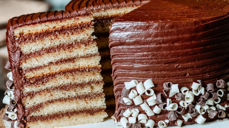 Slice being removed from a whole Smith Island cake