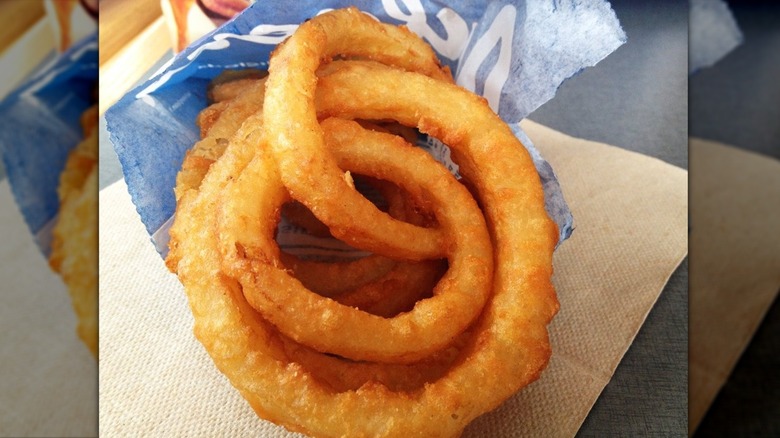 mirrored image of Culver's Onion Rings coming out of the blue packet