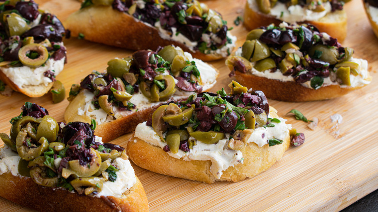 Goat cheese and olives on bread