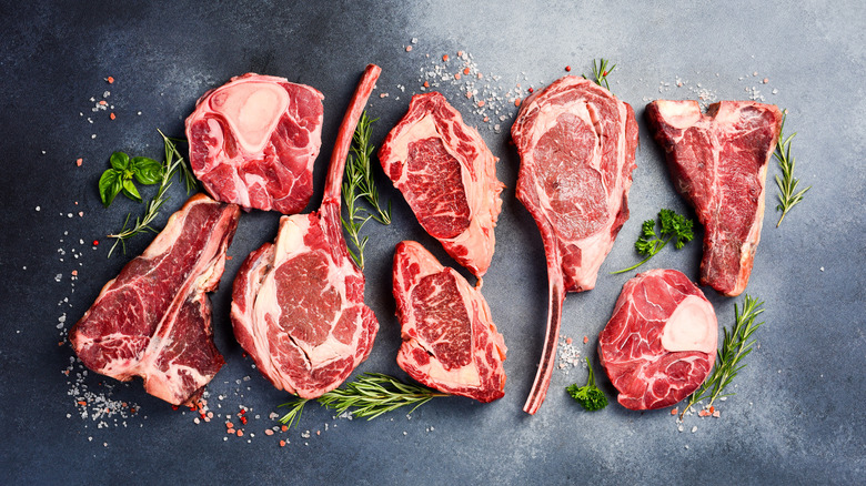 different cuts of steak on marble