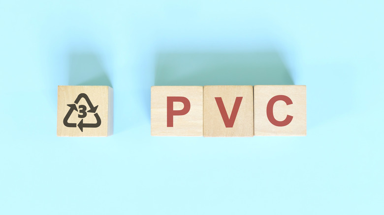 Wooden blocks displaying PVC and #3 recycling symbol