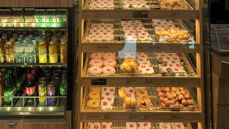 A half empty donut shelf at Tim Hortons.