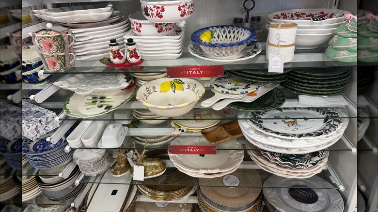 shelves filled with various serving platters at HomeGoods
