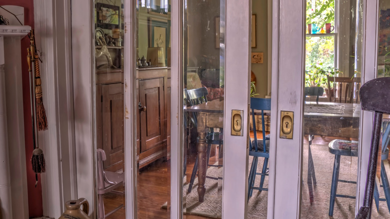 View of glass pocket doors separating the breakfast table from the rest of the house