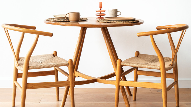 Scandinavian breakfast nook with a wooden table and chairs