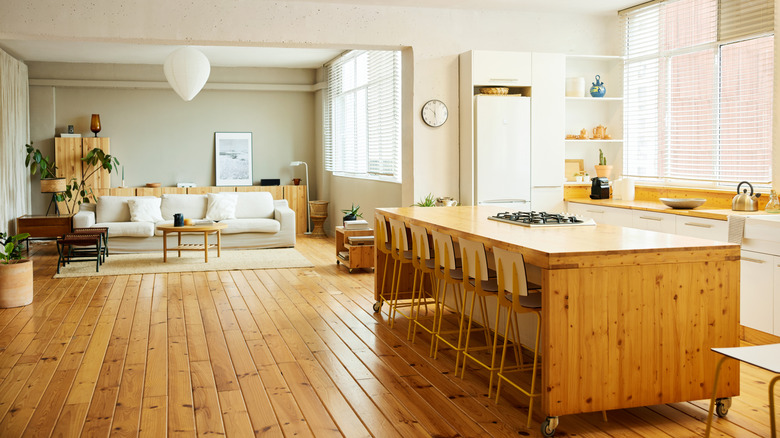 Chairs arranged at a wooden kitchen island