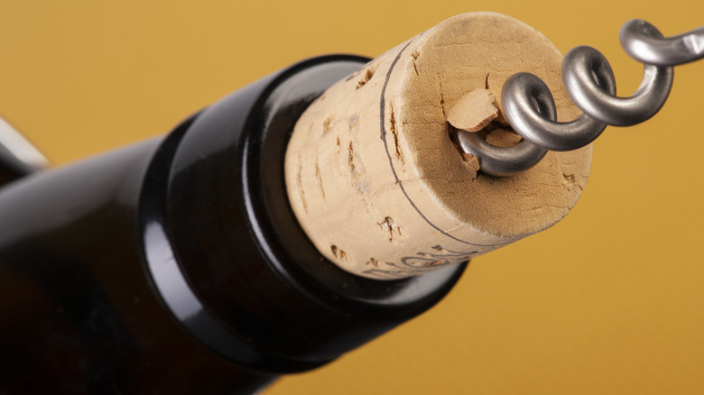 using corkscrew on wine bottle
