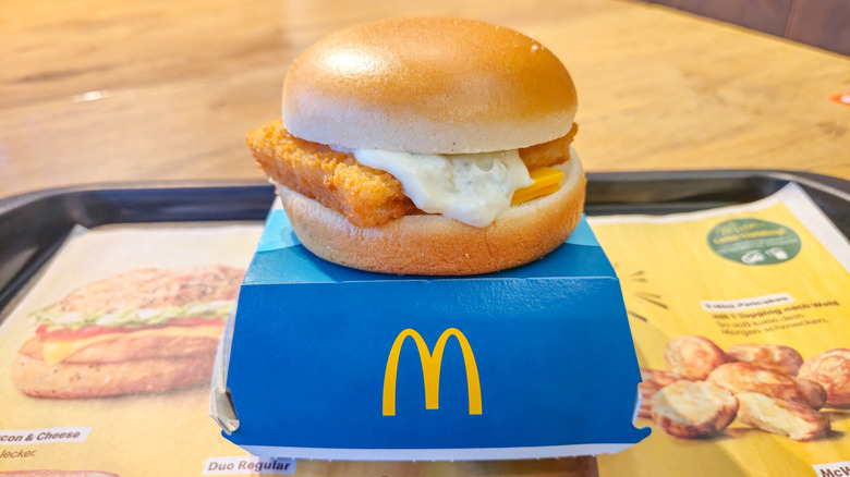 A Filet-O-Fish sitting on a cardboard box