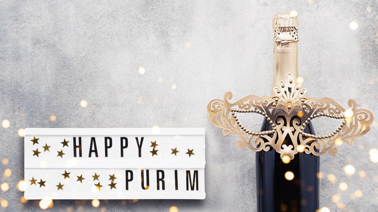 purim sign with masked wine