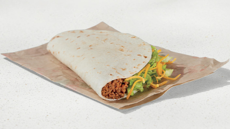 Taco Bell soft taco on folded paper wrapper
