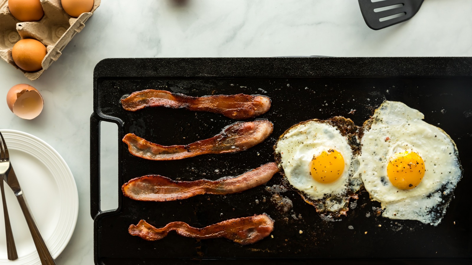 What To Know Before Cleaning The StuckOn Food Bits Off Your Griddle