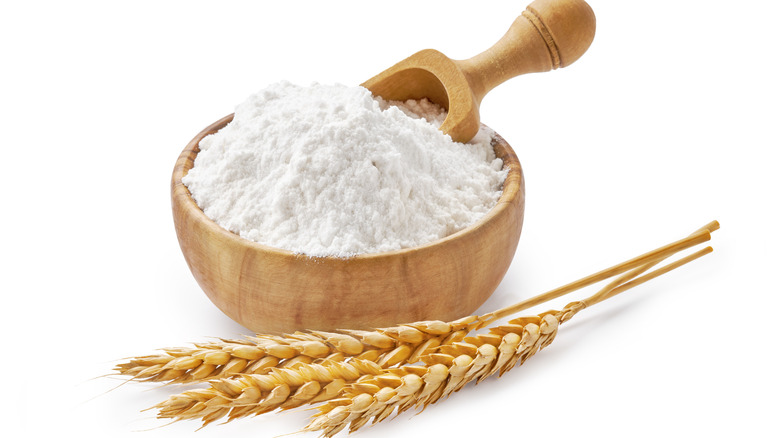 white flour in wooden bowl