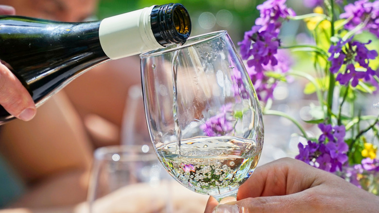 Pouring chardonnay into glass
