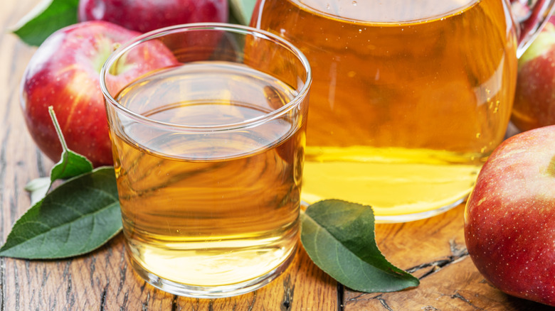 Glass of apple juice and apples