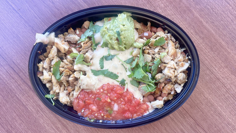 Top view of queso burrito bowl on a table