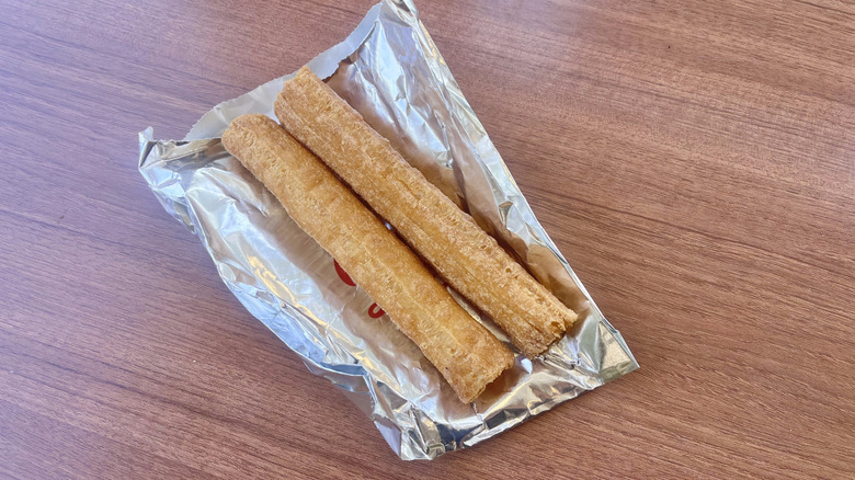 Churros on foil on a table