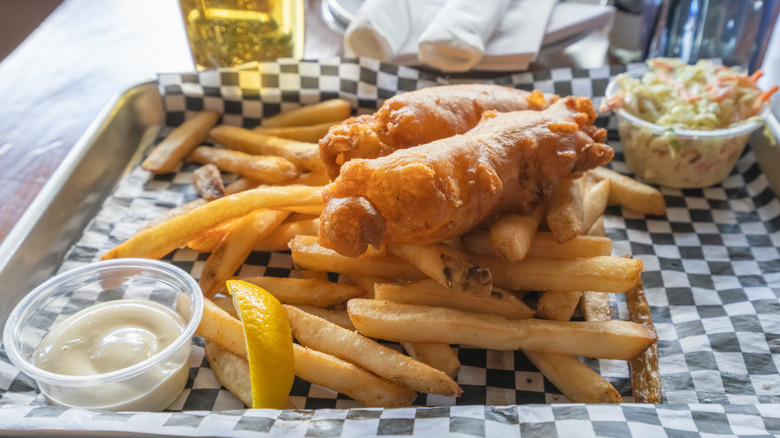 Americanized fish and chips with french fries and coleslaw