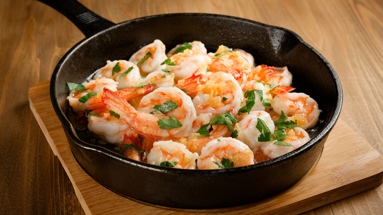 shrimp in a pan with basil