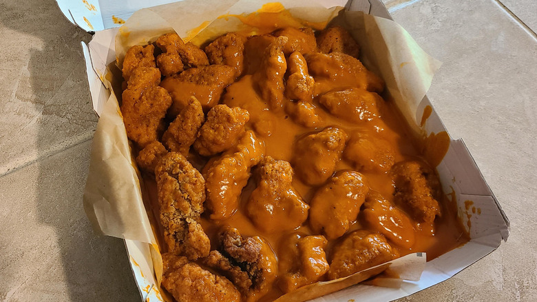 An order of heavily sauced extra-wet chicken wings from Buffalo Wild Wings
