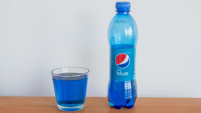 pepsi blue bottle and in glass