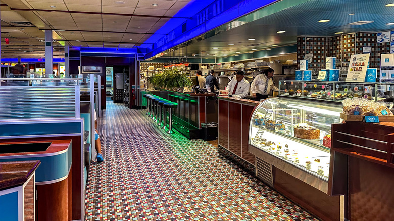 Employees working inside retro-style American diner