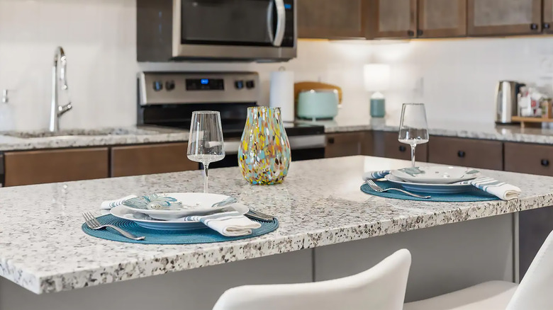 fresh and clean kitchen with a granite countertop