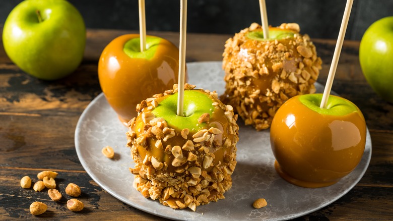 Caramel apples covered in nuts