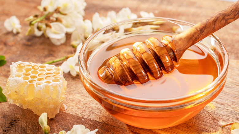 bowl of honey with dipper