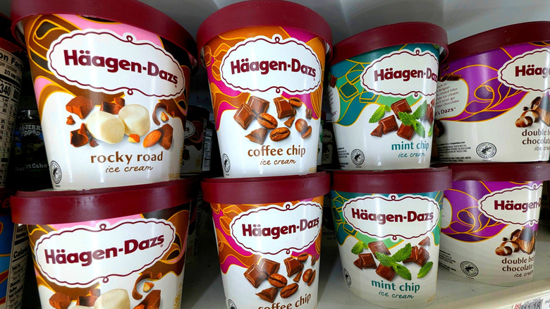 A freezer full of pints of various flavored Häagen-Dazs ice cream.