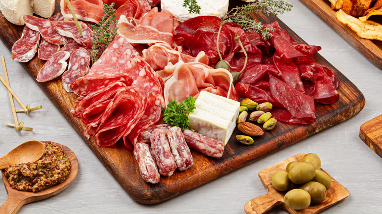 Charcuterie board emphasizing meat