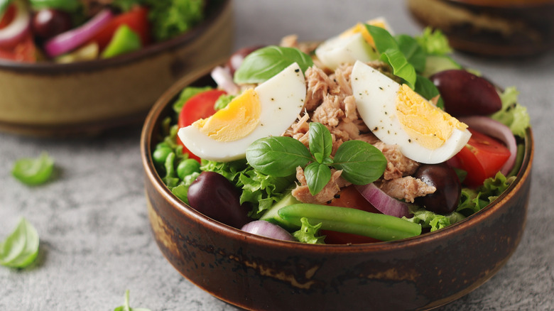 French Niçoise salad in a bowl on a table