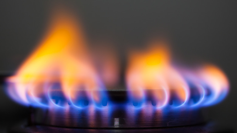 blue to orange flames from a stove burner