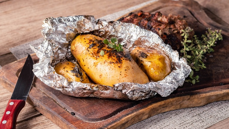 Cooked potatoes in aluminum foil