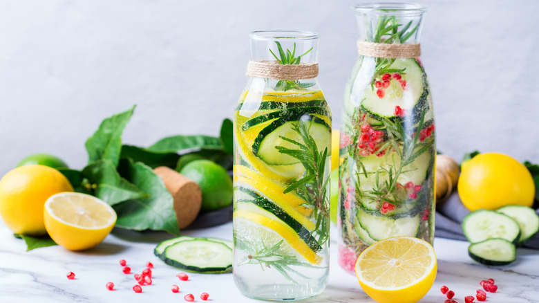 Carafe with cucumbers, citrus, and herbs