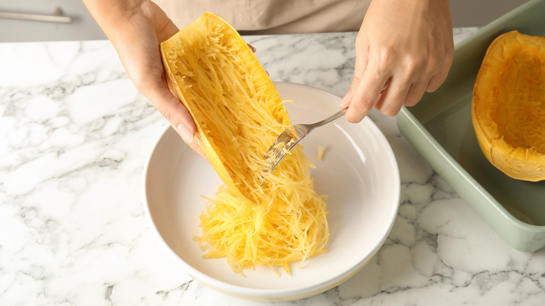 Scraping spaghetti squash with a fork