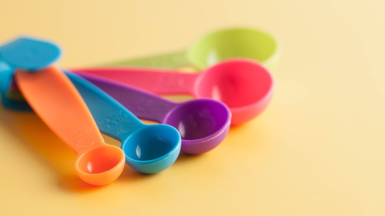 A set of colorful plastic measuring spoons