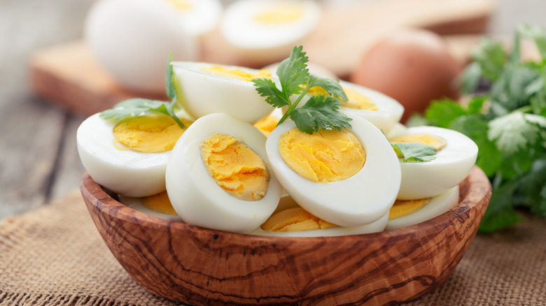wooden bowl with hard-boiled eggs