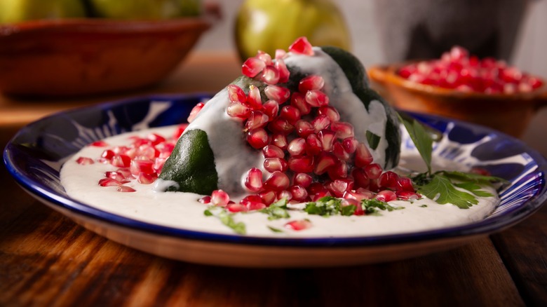traditional chiles en nogada on a blue and white plate