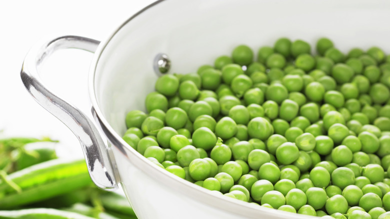 Fresh peas shelled in a colander