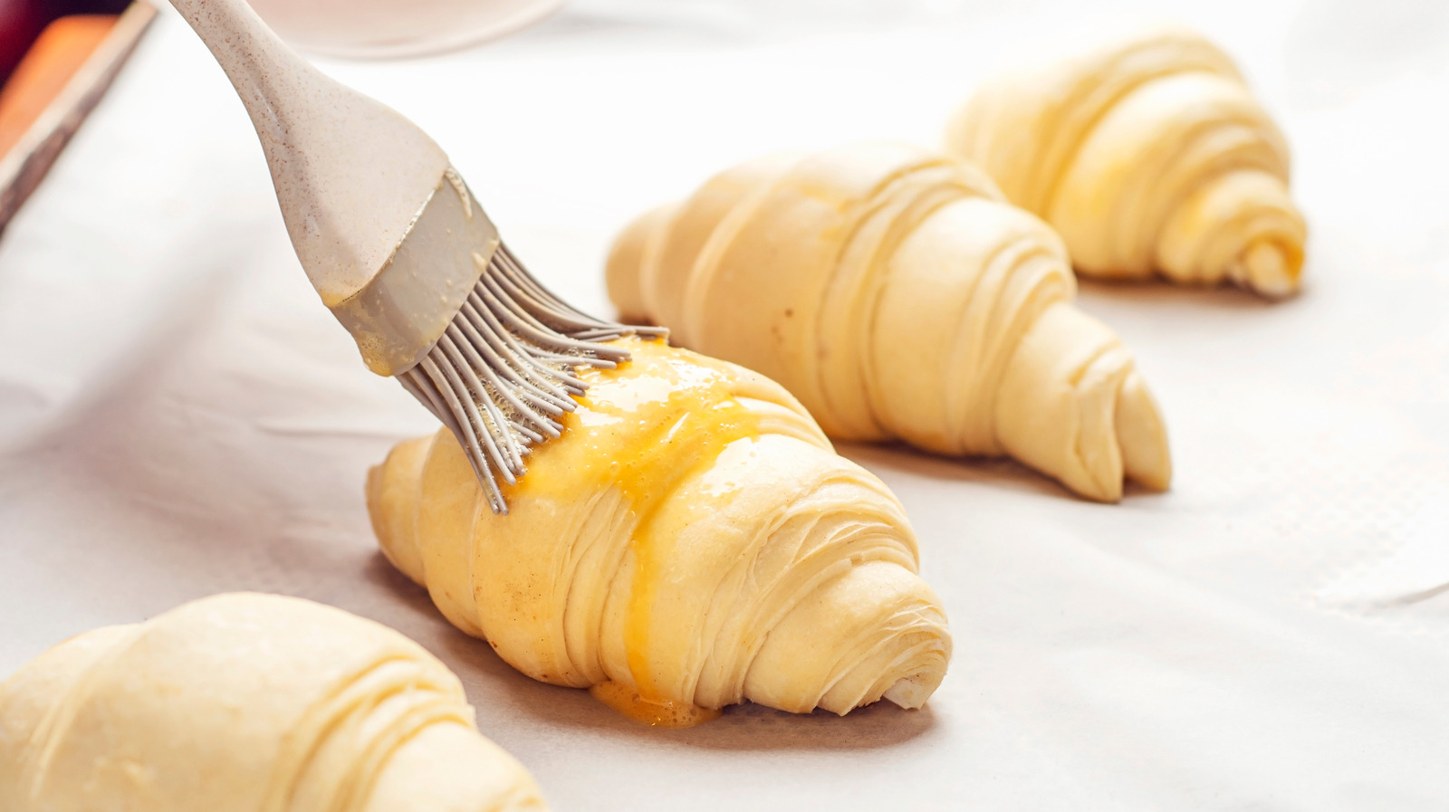 When To Use Milk Vs. Heavy Cream In An Egg Wash