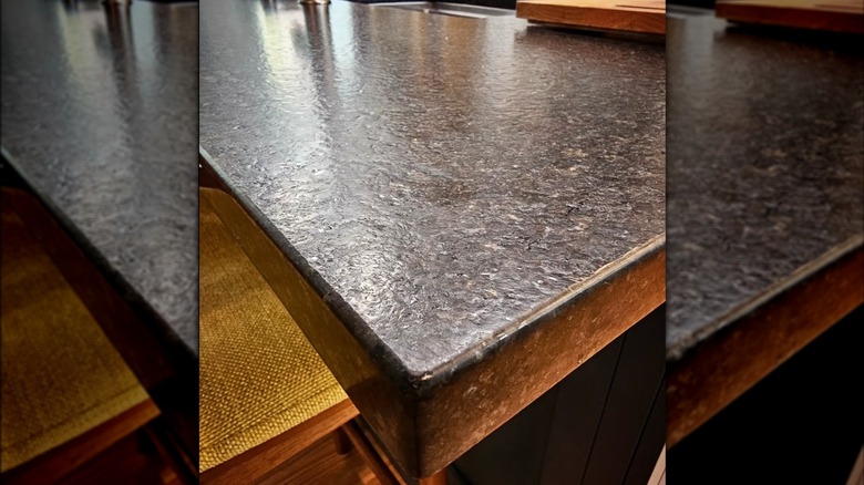 A close up of a black leathered granite countertop.