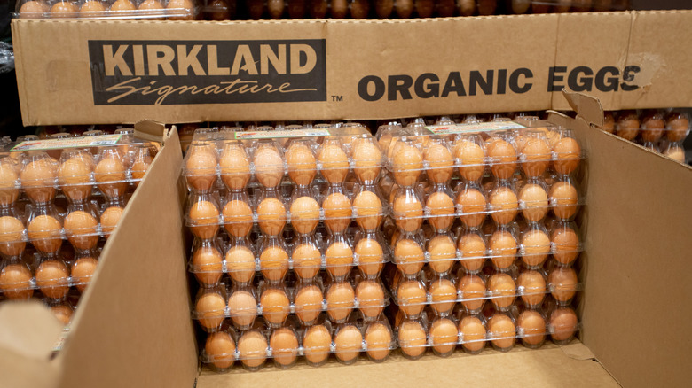 Cartons of Kirkland Signature organic eggs stacked in cardboard