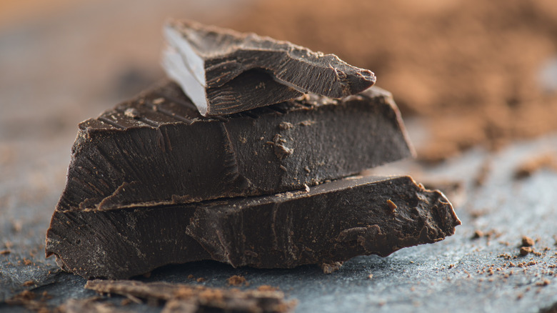 Chocolate chunks on stone background